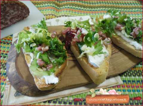 crostini camembert di bufala, mortandela e semi di anguria